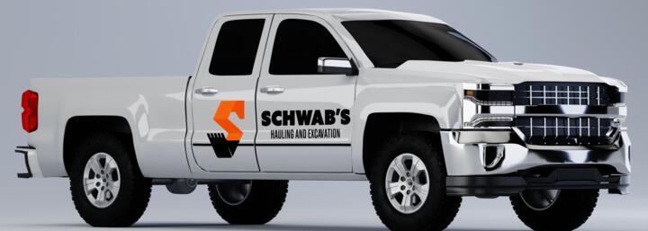 Truck magnet design for Schwab’s Hauling and Excavation, a Tech Handoff client, on a pickup truck mockup.